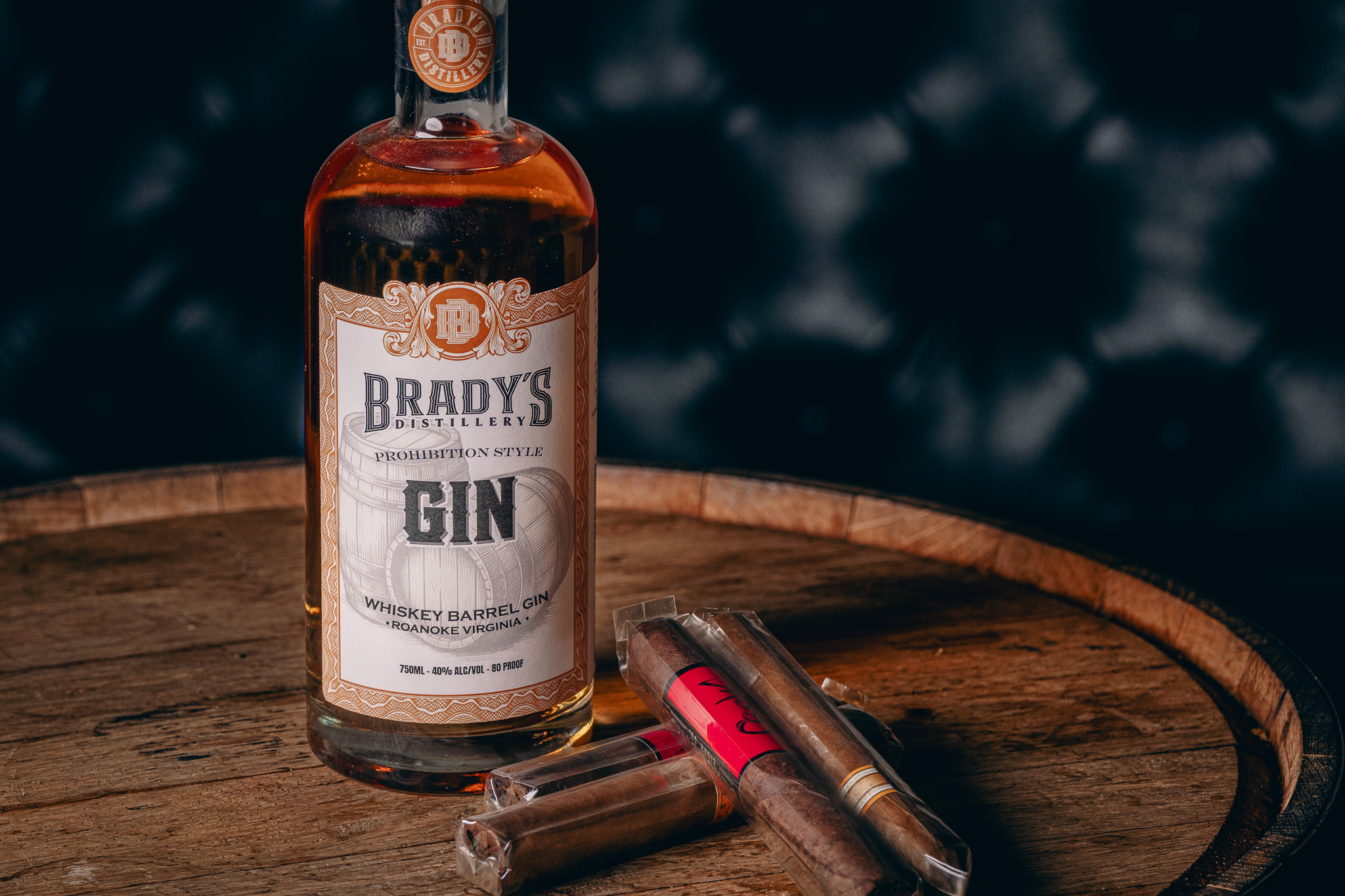 Brady's Prohibition Style Gin with cigars on a barrel